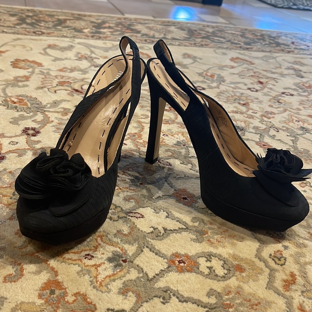 black back strap heels with flower ruffle